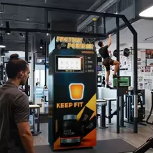 Protein shake vending machine operating in a fitness setting